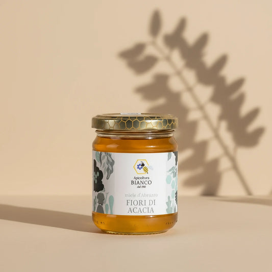 Jar of honey with a decorative label on a artistic background